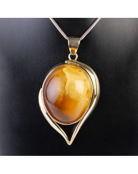 Esclusivo gioiello in argento con grande cabouchon di ambra baltica Butterscotch.