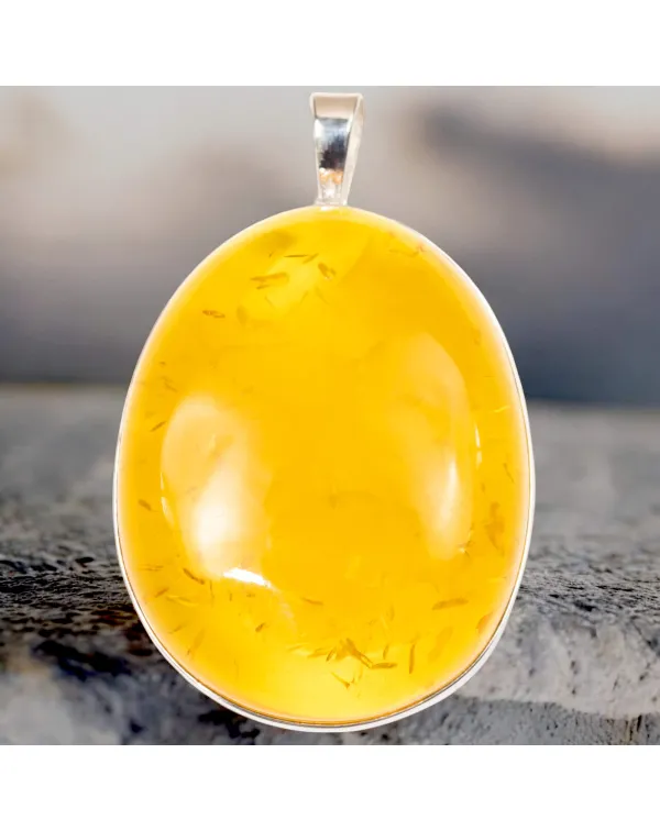 Ciondolo in argento con ambra color miele: eleganz...